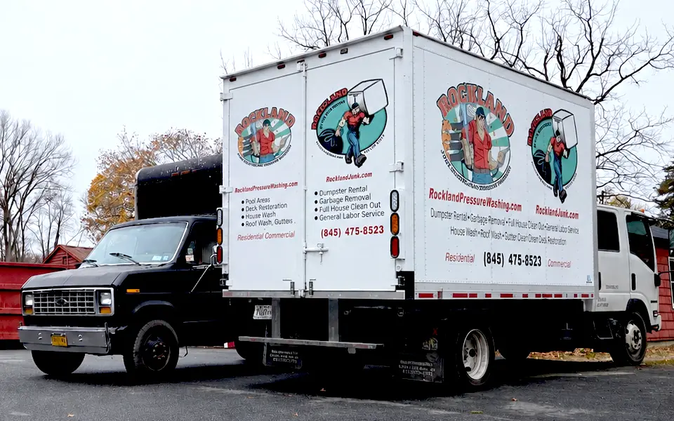White Rockland Junk Removal box truck with company branding and service information.